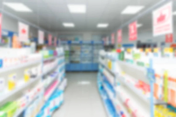 Abstrakter Hintergrund Verschwimmt Regal Mit Medikamenten Und Anderen Waren Apotheke — Stockfoto