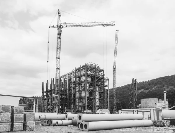 industrial landscape construction site of the gypsum processing plant, black and white photo