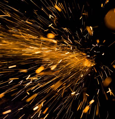 Siyah bir zemin üzerine parlak sarı Sparks