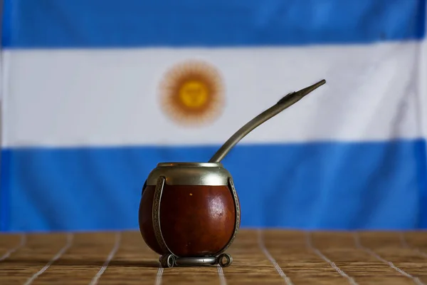 mate with flag of Argentina  in the background