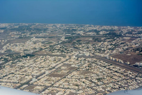 View from the plane of the city of Seeb, near Muscat (Oman)