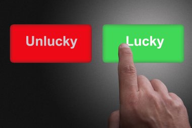 Yazılı Lucky ve Unlucky ve işaret parmağı ile Düğmeler, bir