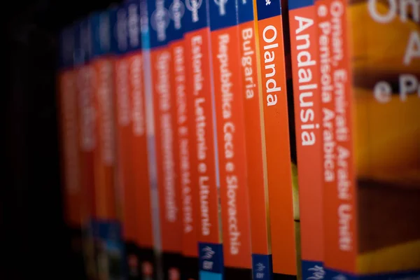 Books of the Lonely Planet series on the bookcase with only the — Stock Photo, Image