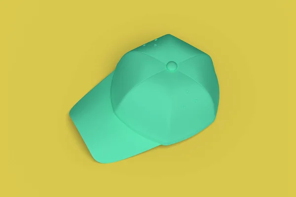 Green baseball hat on a yellow background abstract image. Minima — Stock Photo, Image