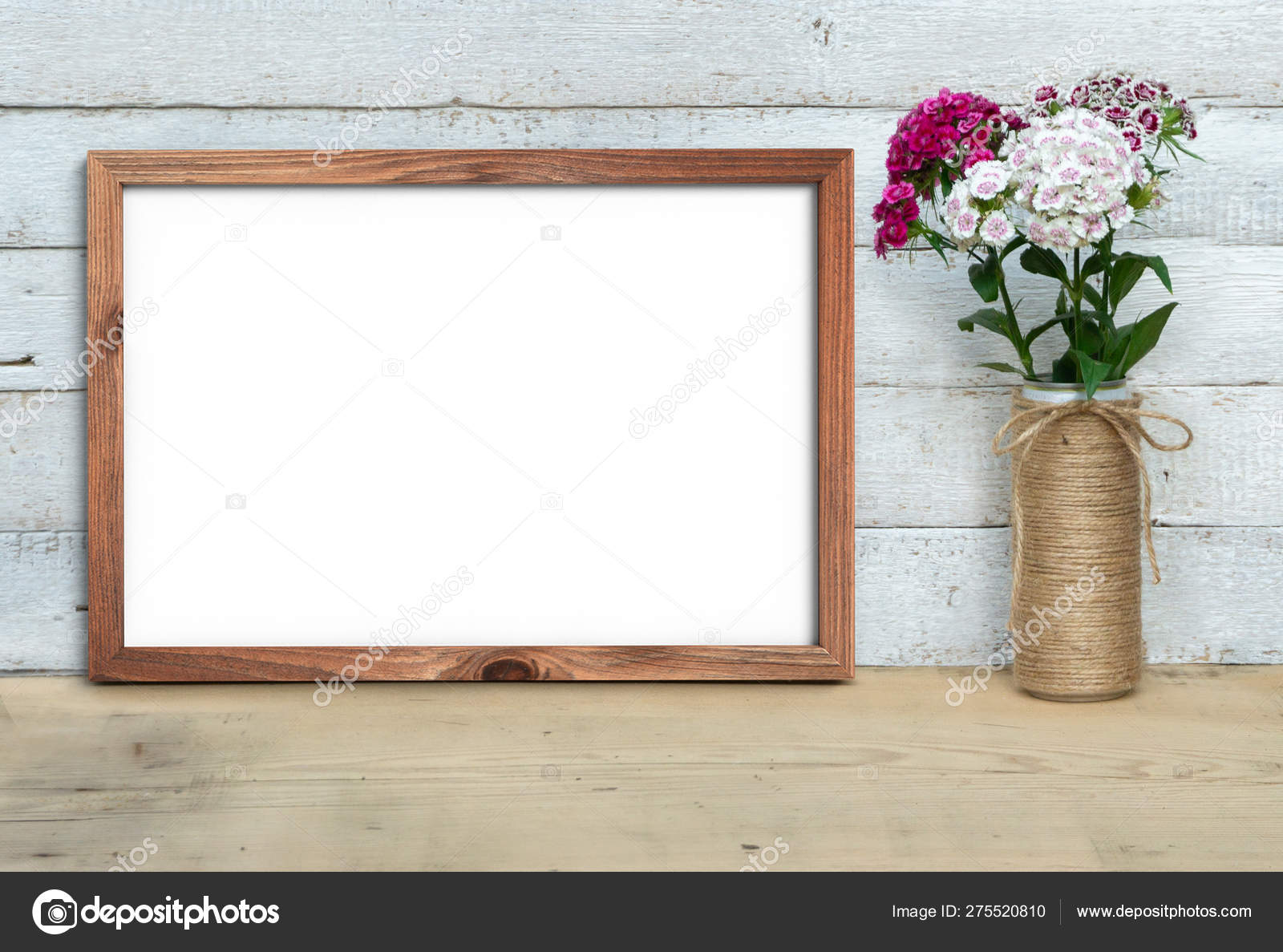 Vertical A4 Old Wooden Frame mockup near a bouquet of sweetwill Stock