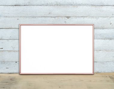 Rose Gold A4 yatay Çerçeve mockup ahşap bir masa üzerinde duruyor