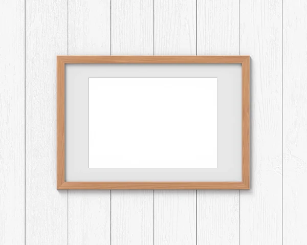 Horizontale houten frames mockup met een rand opknoping aan de muur. Lege basis voor afbeelding of tekst. 3D-rendering. — Stockfoto