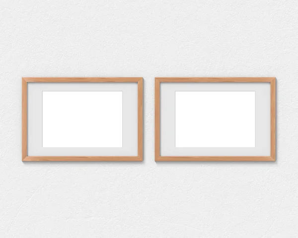 壁に掛かっている境界線を持つ2つの水平木製フレームモックアップのセット。画像またはテキストの空のベース。3D レンダリング. — ストック写真