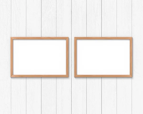 Set of 2 horizontal wooden frames mockup hanging on the wall. Empty base for picture or text. 3D rendering. — Stock Photo, Image