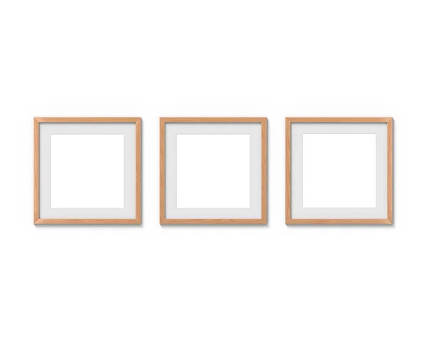 Conjunto de 3 quadros quadrados de madeira mockup com uma borda pendurada na parede. Base vazia para imagem ou texto. Renderização 3D . — Fotografia de Stock