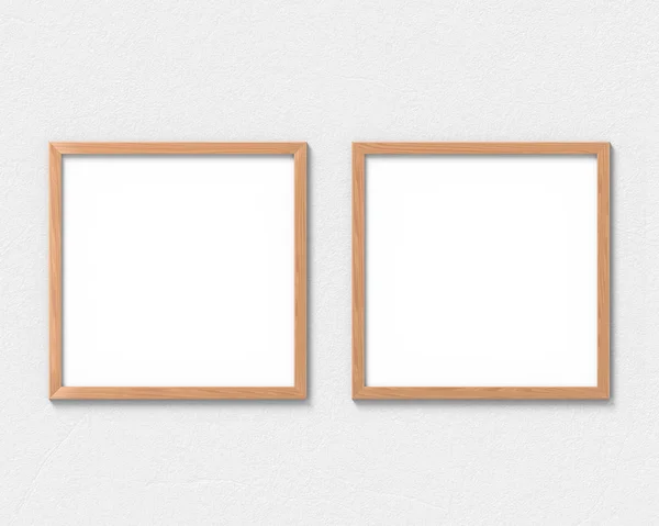 Conjunto de 2 quadros quadrados de madeira mockup pendurado na parede. Base vazia para imagem ou texto. Renderização 3D . — Fotografia de Stock