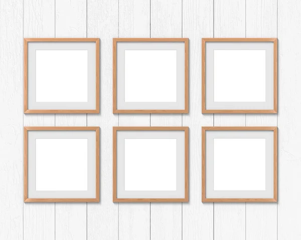 Conjunto de 6 quadros quadrados de madeira mockup com uma borda pendurada na parede. Base vazia para imagem ou texto. Renderização 3D . — Fotografia de Stock