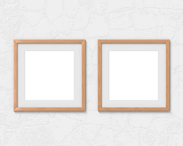 Набір з 2 квадратних дерев'яних рамок макет з бордюром, що висить на стіні. Порожня основа для зображення або тексту. 3D візуалізація . — стокове фото