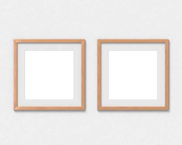 Set of 2 square wooden frames mockup with a border hanging on the wall. Empty base for picture or text. 3D rendering. — Stock Photo, Image