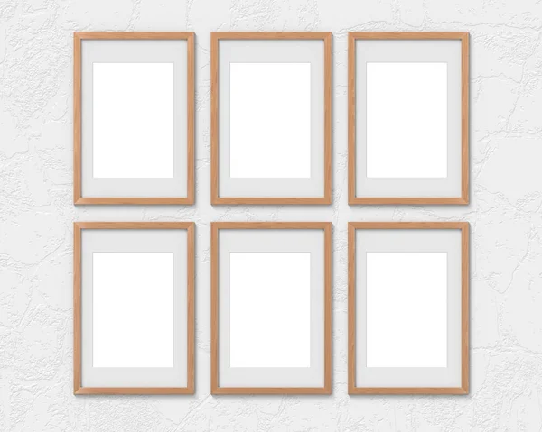 Set aus 6 vertikalen Holzrahmen-Attrappen mit einem an der Wand hängenden Rand. leere Basis für Bild oder Text. 3D-Darstellung. — Stockfoto
