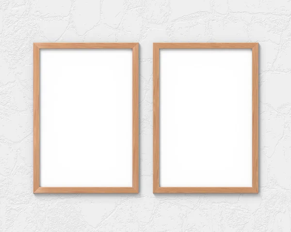 Set of 2 vertical wooden frames mockup with a border hanging on the wall. Empty base for picture or text. 3D rendering. — Stock Photo, Image