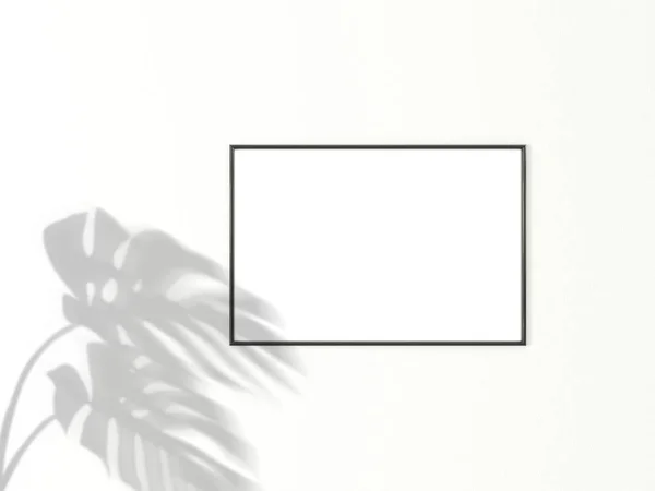 stock image 2x3 horizontal Black frame for photo or picture mockup on white background with shadow of monstera leaves. 3D rendering.