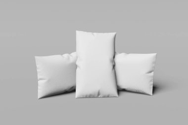 Gri bir arka plan üzerinde üç Beyaz dikdörtgen mocap yastık. 3d render.