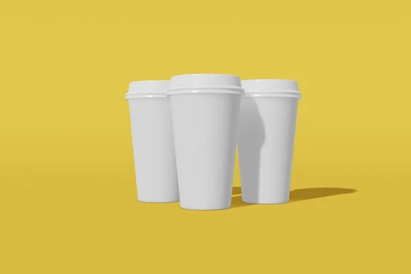 Conjunto de três copos de mockup de papel branco com uma tampa sobre um fundo amarelo. Renderização 3D — Fotografia de Stock