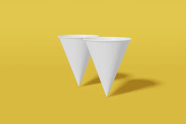Set van twee witte papieren mockup cups kegelvormig op een gele achtergrond. 3D-rendering — Stockfoto