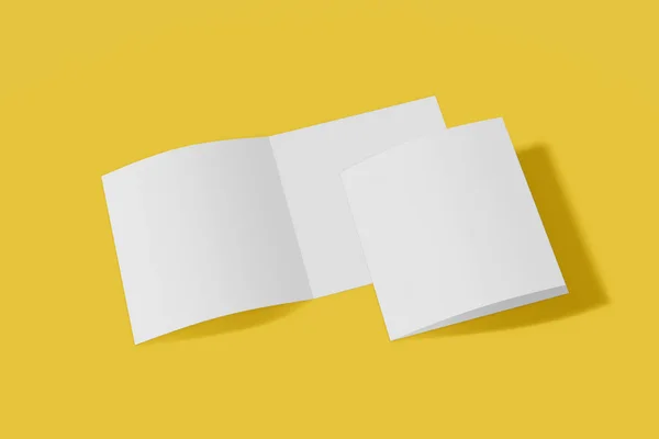 Två mockup kvadratiska häfte, broschyr, inbjudan isolerad på en gul bakgrund med mjukt omslag och realistisk skugga. 3D-rendering. — Stockfoto