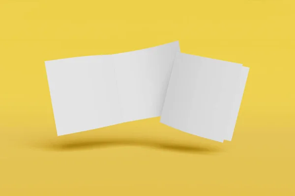 Δύο μοντέλα τετράγωνο φυλλάδιο, φυλλάδιο, πρόσκληση απομονωμένη σε ένα κίτρινο φόντο με απαλό κάλυμμα και ρεαλιστική σκιά. απόδοση 3D. — Φωτογραφία Αρχείου