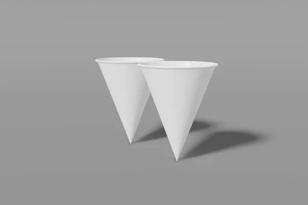 Conjunto de dois copos de mockup de papel branco em forma de cone sobre um fundo cinza. Renderização 3D — Fotografia de Stock