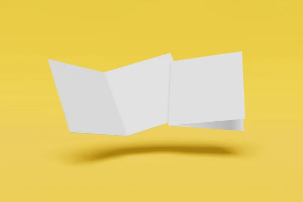 Два макета квадрата буклета, брошюра, приглашение изолированы на желтом фоне с твердой обложкой и реалистичной тенью. 3D рендеринг . — стоковое фото