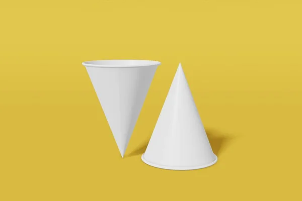 Два бумажных стакана макета конуса в форме желтого фона. Одна из чашек перевернута с ног на голову. 3D рендеринг — стоковое фото