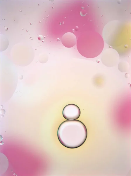 Closeup oil droplets (bubbles ) with white-pink sweet color  ,abstract background ,macro image, pastel wallpaper ,blurred water drops for card design