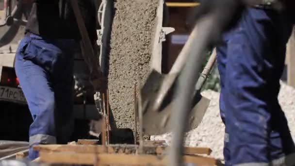 Builders Working Shovel Cement Pouring Concrete on Steel Fence on Floor — Stock Video