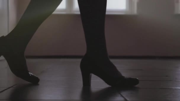 Steps. Silhouette of Legs a Woman Shoes Walking Along Hallway in Slow Motion — Stock Video