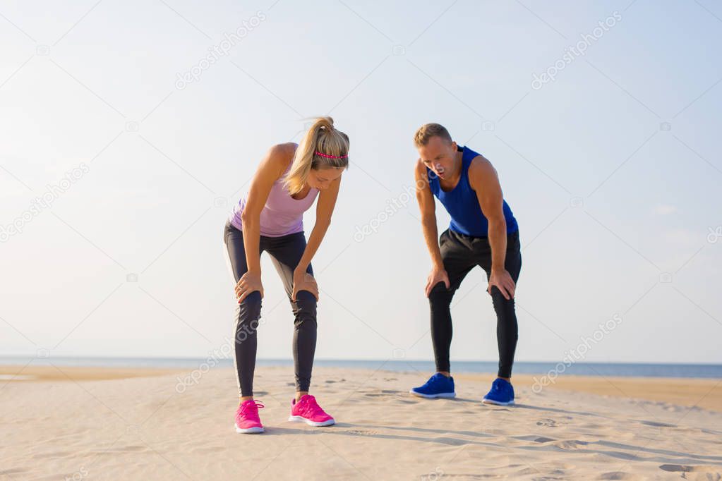 Couple working out by the sea