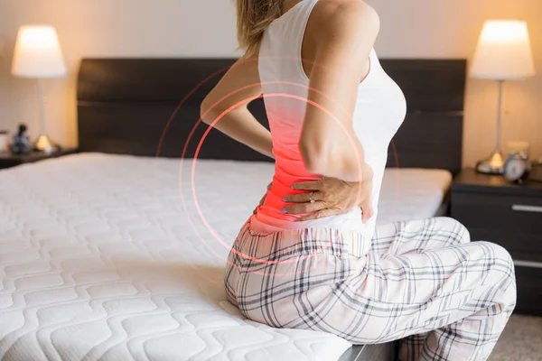 Woman Suffering Back Pain Because Uncomfortable Mattress — Zdjęcie stockowe