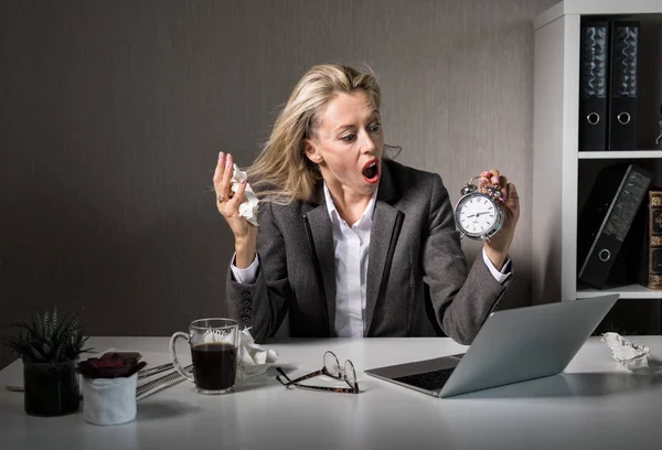 Woman at office in stress about deadline