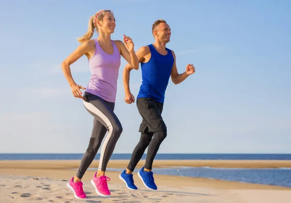 Fit Happy Young Couple Running Outdoors — Stock Photo, Image