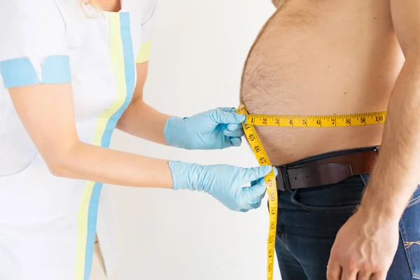 Doctor Measuring Man Body — Stock Photo, Image