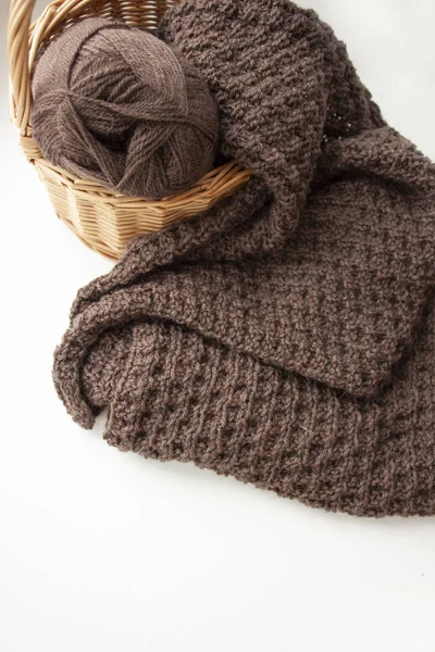 Knitted scarf. Brown scarf. Knitted pattern