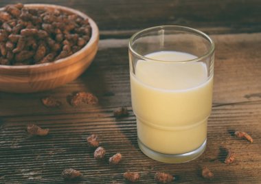 Chufa milk in glass, with tigernut. Alternative type of milks. Vegan non-dairy milk. Lactose-Free Milk and Nondairy Beverages. Lactose intolerance. Healthy food. Superfood. clipart