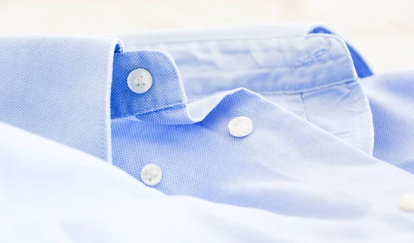 A light blue shirt with a button down collar. Formal wear for events or work and business meetings
