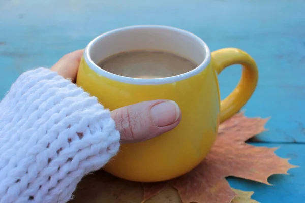Female Hands White Sweater Holding Yellow Cup Coffee Blue Wooden — Stock Photo, Image