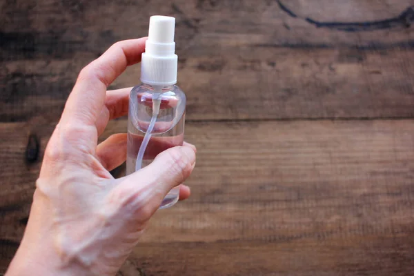 Female Hand Holding Sanitizer Bottle Wooden Background Prevention Coronavirus Concept — Stock Photo, Image