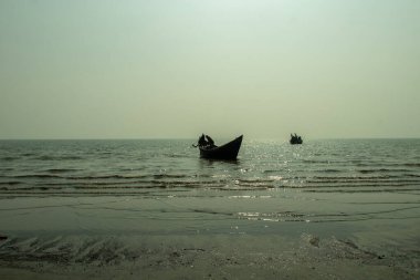 The Asia coastal scene with sandy beaches, tidal flats, wooden fishing boats, local life and nature's changing beauty of landscape sea beach