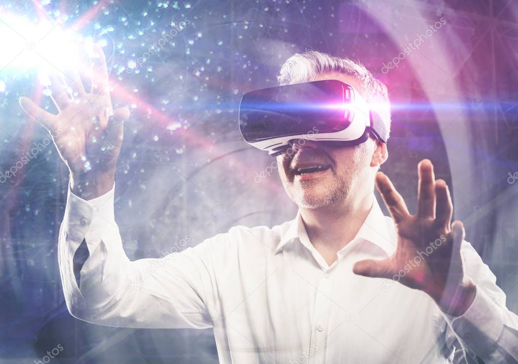 Man experiencing a virtual reality environment, he is wearing a VR headset and interacting with his hands