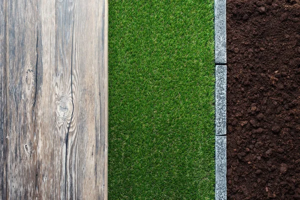 Wooden table, fertile humus soil, lush grass and stone edging, gardening and landscaping concept — Stock Image Wooden Table Fertile Humus Soil Lush Grass Stone Edging Gardening Royalty Free Stock Images