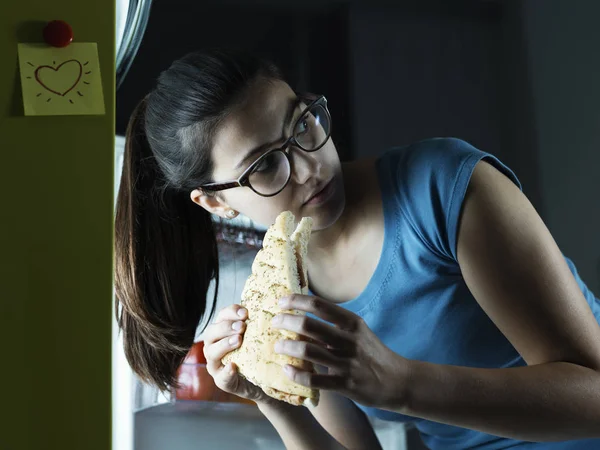 Woman having a late night snack — Stock Photo, Image