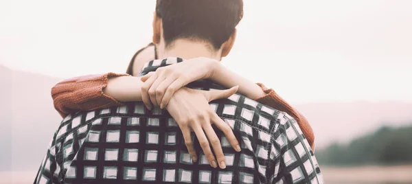 Young loving couple hugging outdoors — Stock Photo, Image