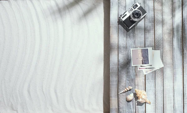 Camera and photos on the beach deck