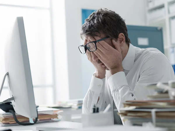Tired stressed businessman rubbing his eyes — Stock Photo, Image
