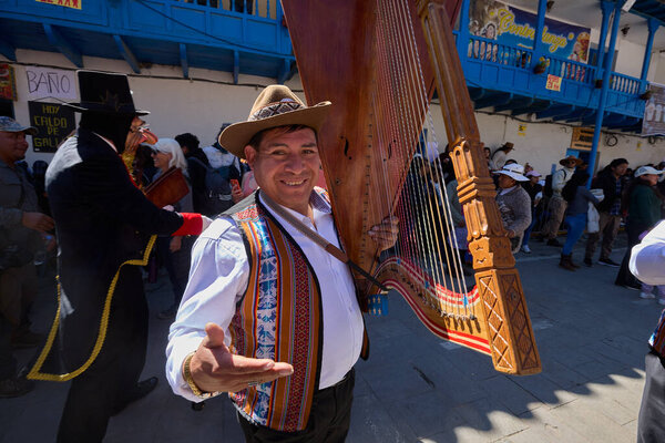 Passionate band performers fill the streets of Paucartambo with powerful melodies during the Virgen del Carmen celebrations, blending devotion, tradition, and vibrant festivity
